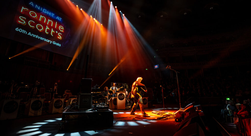 Sam Burgess playing Electric Bass with Nigel Kennedy and his Voodoo Children Band